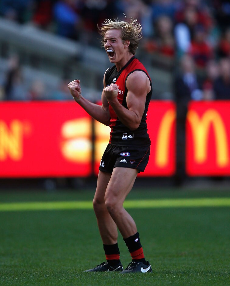 AFL 2016 Rd 02 - Melbourne v Essendon MELBOURNE, AUSTRALIA - APRIL 2: Darcy Parish of the Bombers celebrates a goal during the 2016 AFL Round 02 match between the Melbourne Demons and the Essendon Bombers at the Melbourne Cricket Ground, Melbourne on April 2, 2016. (Photo by Sean Garnsworthy/AFL Media)